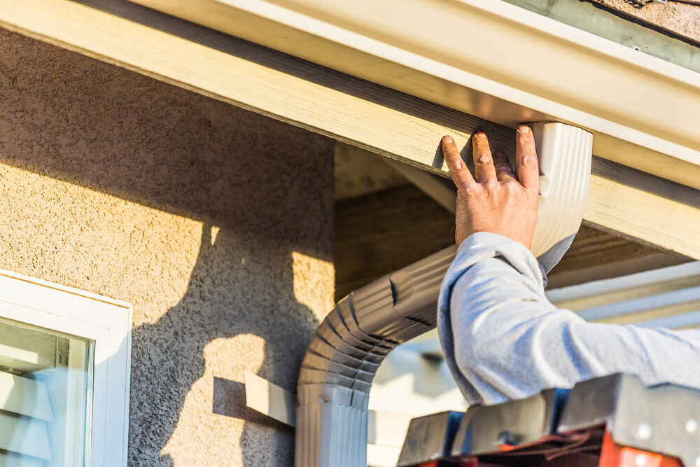 professional installing gutter